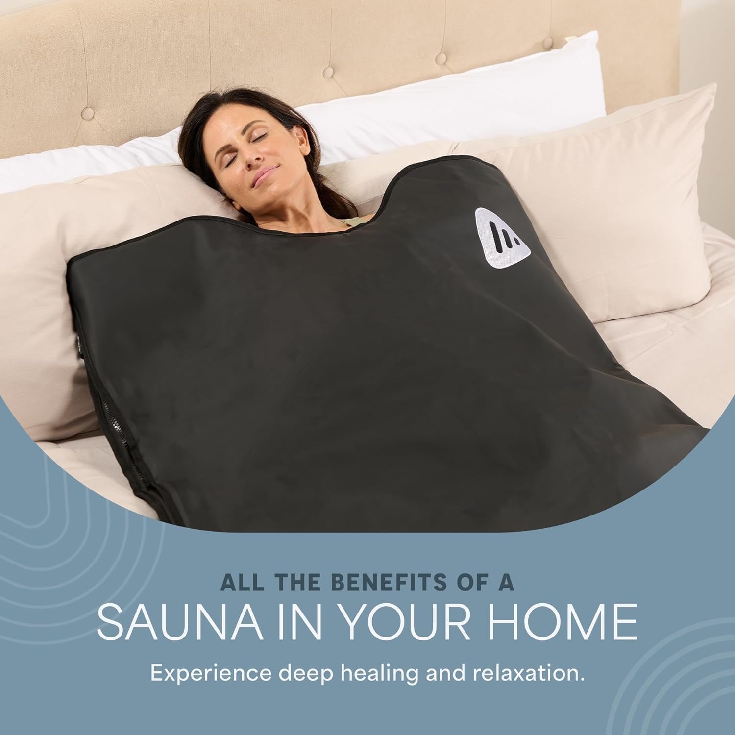 Woman using an infrared sauna blanket at home