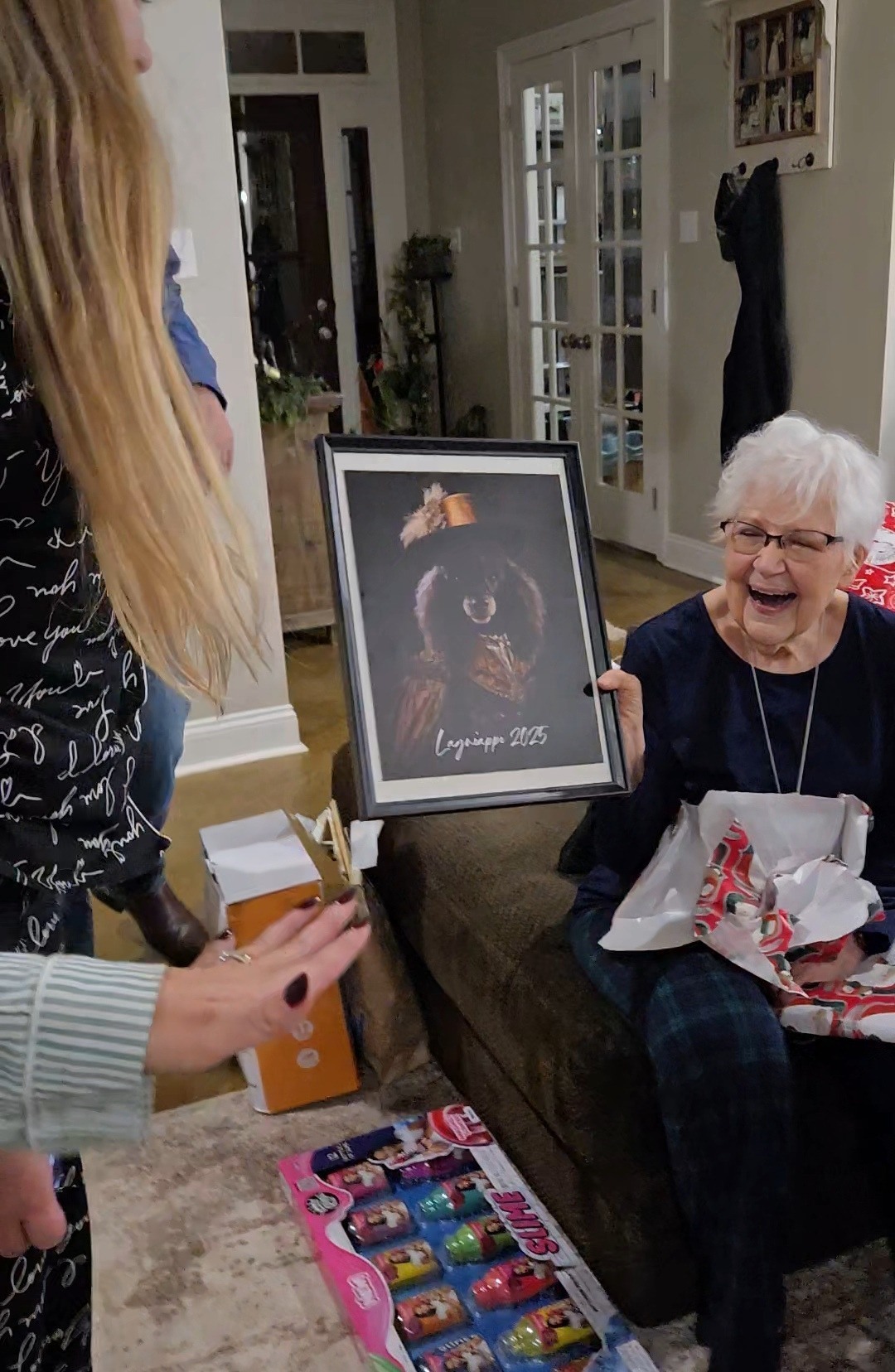 Pet owner receiving a framed custom dog portrait